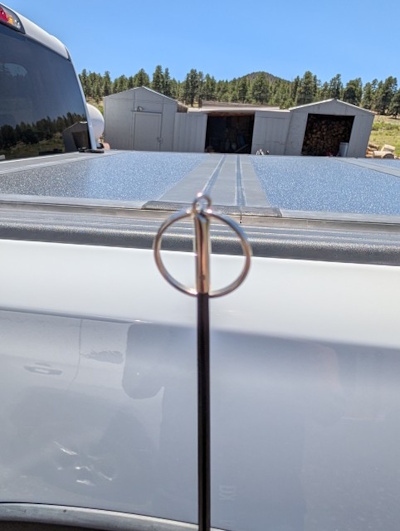 DX Commander pole top section extended with the added key ring visible